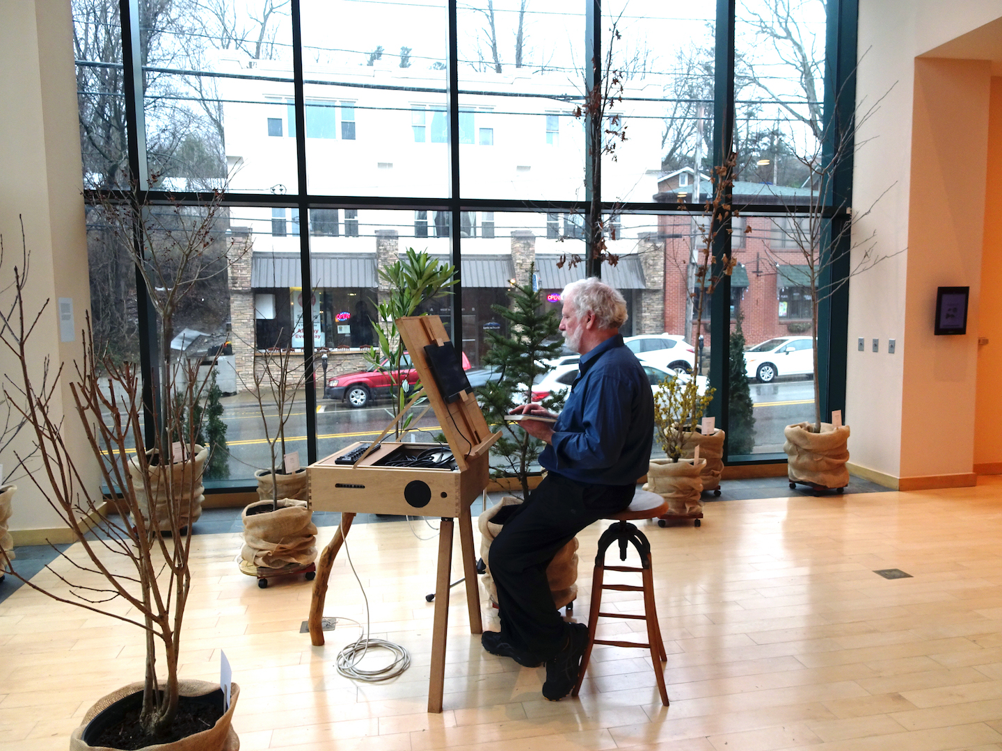 Tim Collins at the Plein Air instrument easel in Southern Appalachian Forest, North Carolina